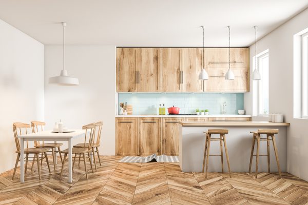 White Scandinavian style kitchen interior with blue tiled and white walls, a wooden floor, wooden countertops and cabinets and a table with chairs. 3d rendering mock up